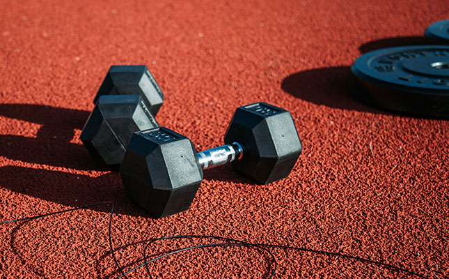 Dumbbells and Skipping Rope on Ground