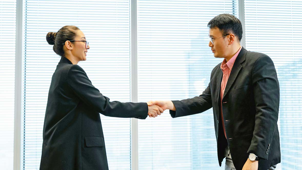 Woman and Man Shaking Hands